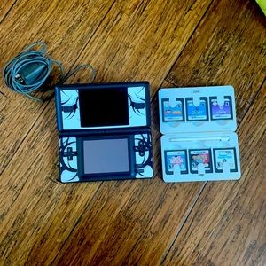 Nintendo DS console with charger and games